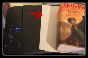 image shows printer with stock paper and Harry Potter book, ready to copy pages for a book lover ornament