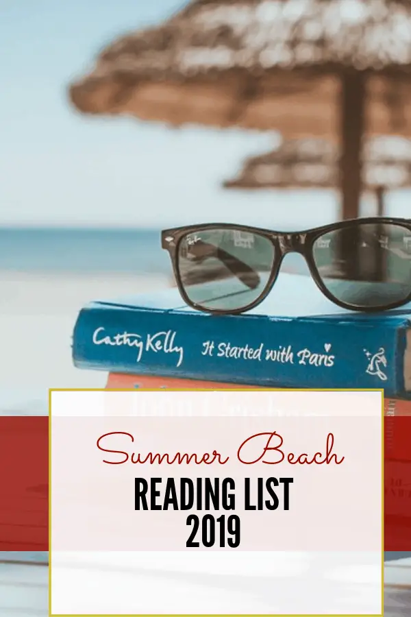 books and sunglasses under a tiki hut, ready for summer reading