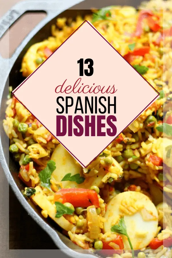 image of paella, yellow rice with colorful veggies is background for words: 13 delicious Spanish dishes