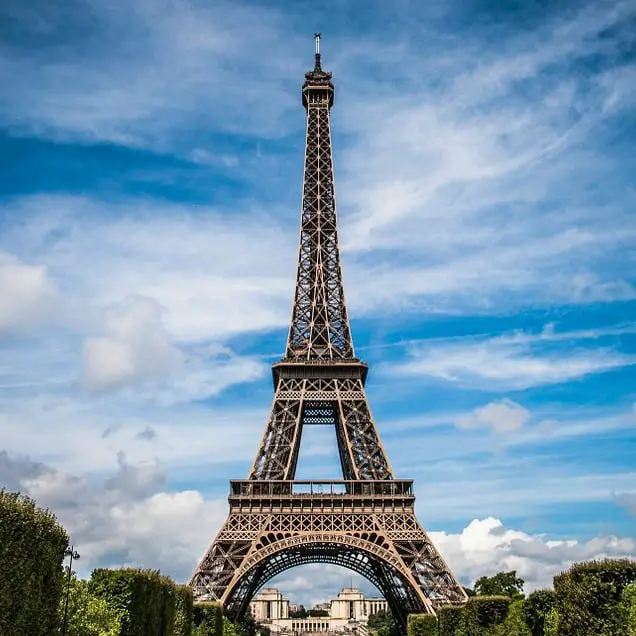 Eiffel Tower with a cloudy blue sky in the background - books set in France