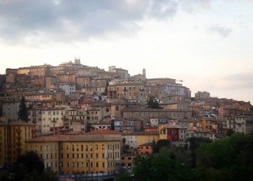 small Italian village of Perugia houses of natural colors built up the side of a mountain