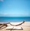 beach scene with chair and book